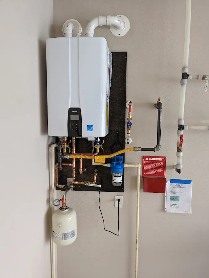 Professional plumber installing copper piping in a Miami Shores home